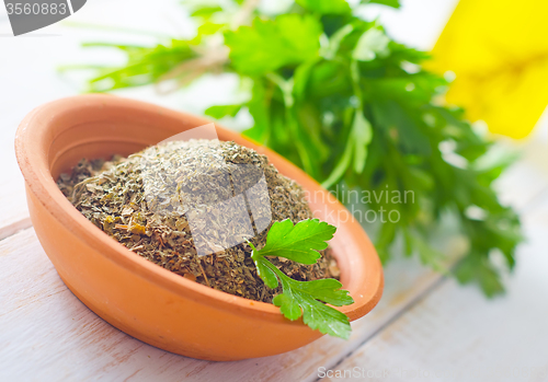 Image of Dry parsley in the bowl, green parsley