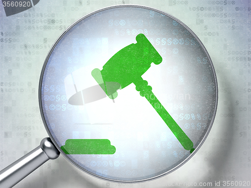 Image of Law concept: Gavel with optical glass on digital background