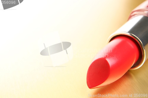 Image of lipstick on gold background