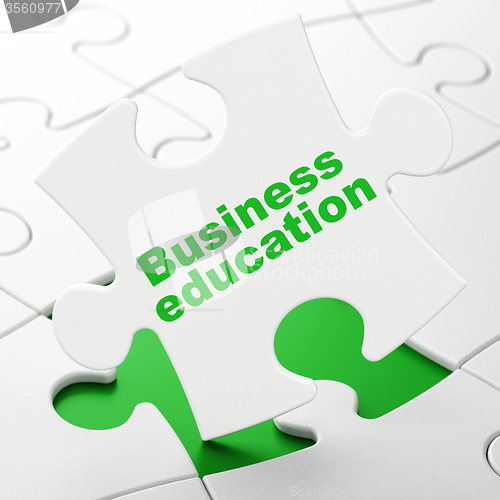 Image of Studying concept: Business Education on puzzle background