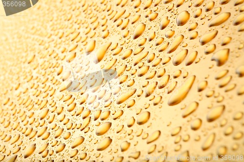 Image of water drops background on gold