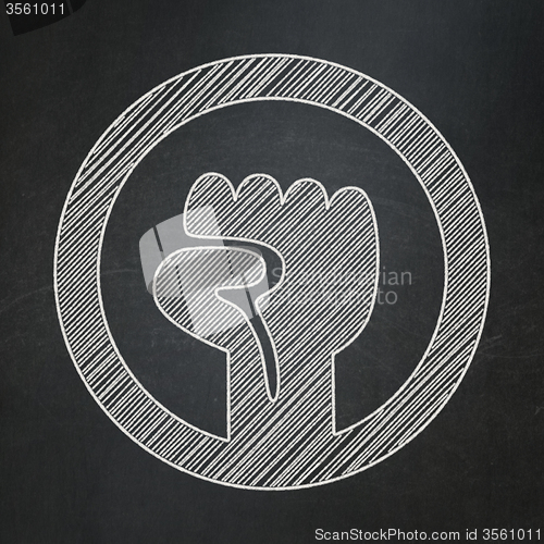 Image of Political concept: Uprising on chalkboard background