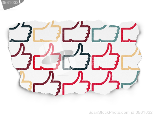 Image of Social media concept: Thumb Up icons on Torn Paper background