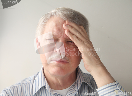 Image of older man with head pain