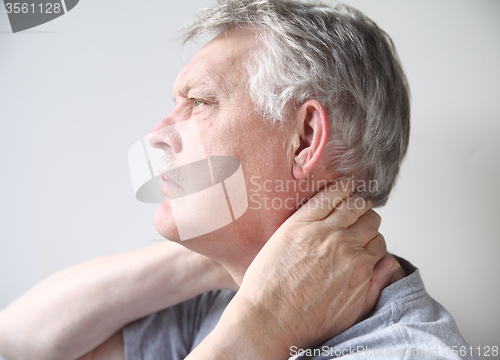 Image of man with pain in neck 