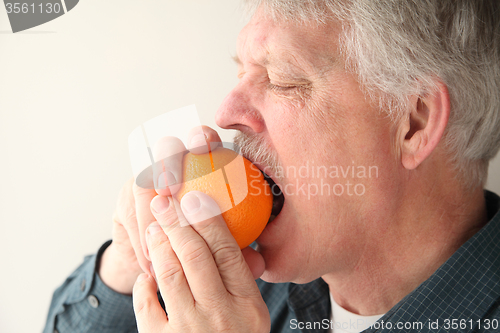 Image of senior man with orange