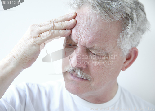 Image of senior with headache