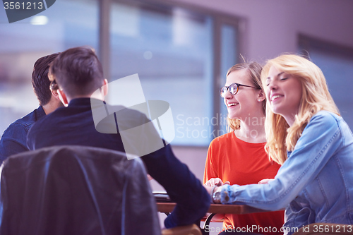 Image of students group working on school  project  together