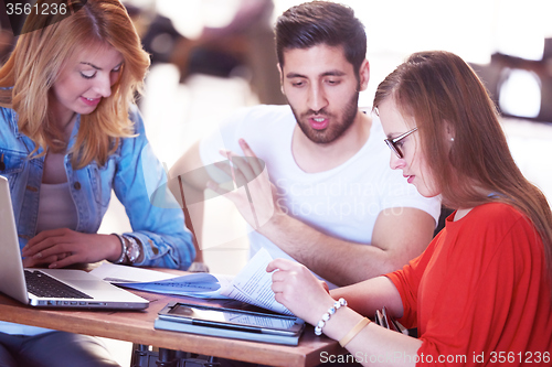 Image of students group working on school  project  together