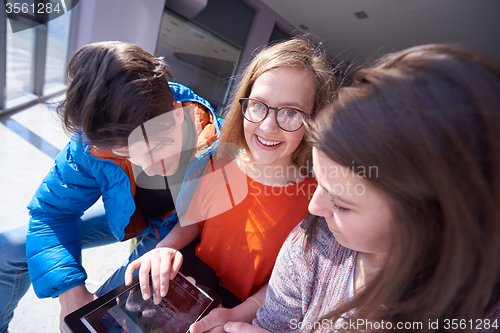 Image of students group working on school  project  together