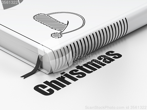 Image of Holiday concept: book Christmas Hat, Christmas on white background