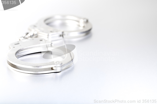 Image of handcuffs high-key closeup