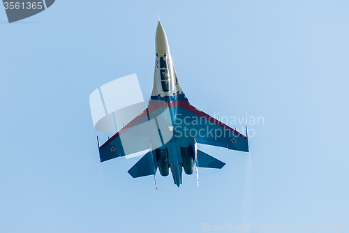 Image of Russian fighter SU-27 flies upside down