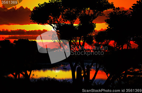 Image of Sunset over beautiful lake region