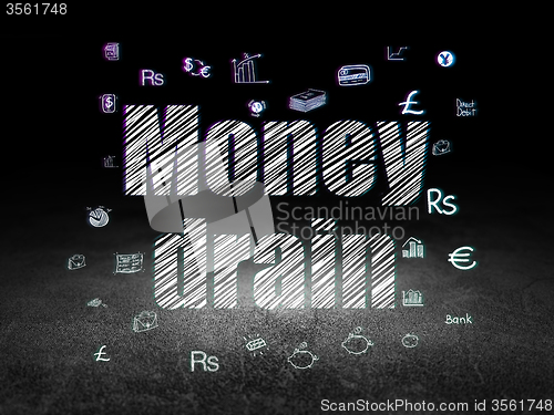 Image of Money concept: Money Drain in grunge dark room