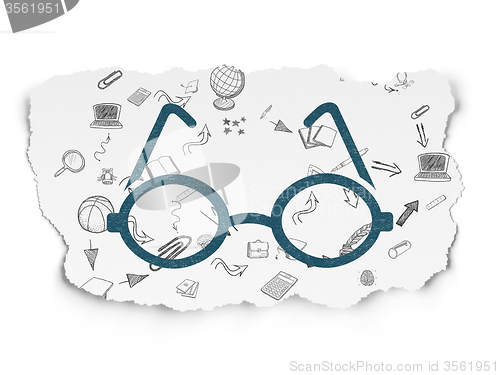 Image of Studying concept: Glasses on Torn Paper background