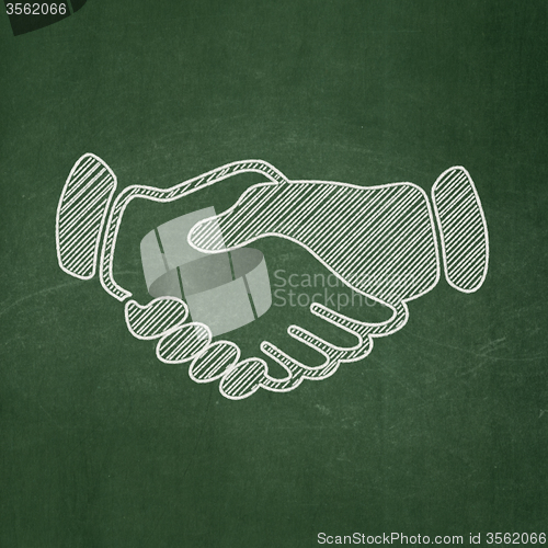 Image of Politics concept: Handshake on chalkboard background