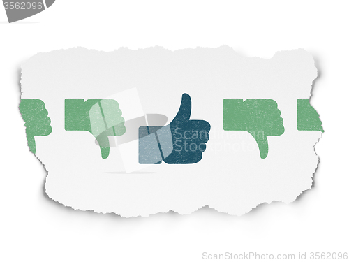 Image of Social network concept: thumb up icon on Torn Paper background