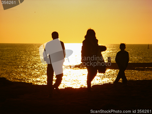 Image of family at sunset