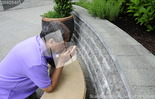 Image of African american male praying.