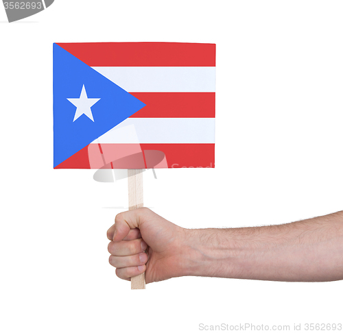 Image of Hand holding small card - Flag of Puerto Rico