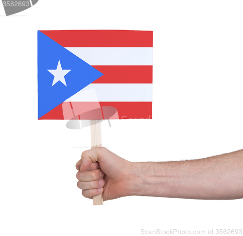 Image of Hand holding small card - Flag of Puerto Rico