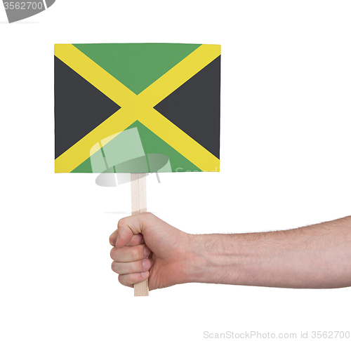 Image of Hand holding small card - Flag of Jamaica