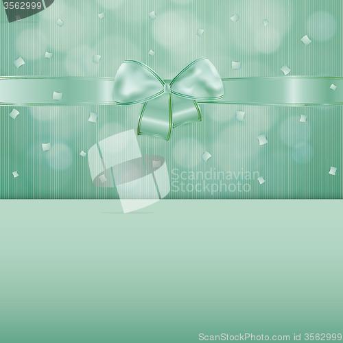 Image of green gift card with ribbon and confetti