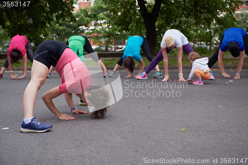Image of jogging people group stretching