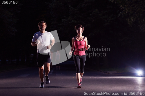 Image of couple jogging at early morning