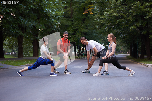 Image of jogging people group stretching