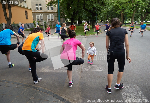 Image of jogging people group stretching