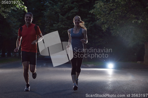 Image of couple jogging at early morning