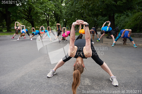 Image of jogging people group stretching
