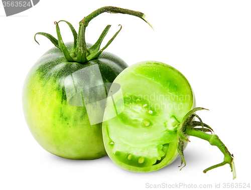 Image of Whole and half green tomatoes