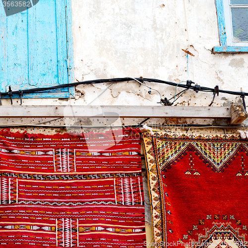 Image of blue window in morocco africa old construction and brown wall re