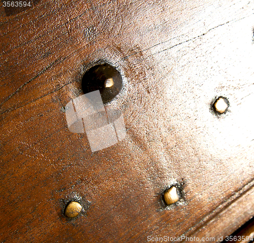 Image of  in mozzate  brass brown knocker   door curch  closed metal wood
