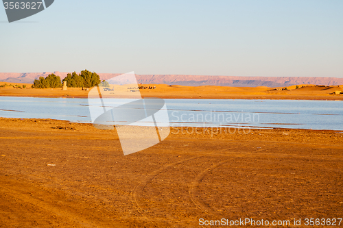 Image of sunshine in the lake yellow  sand and     dune