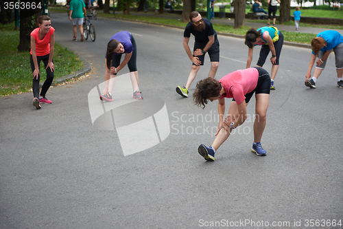 Image of jogging people group stretching