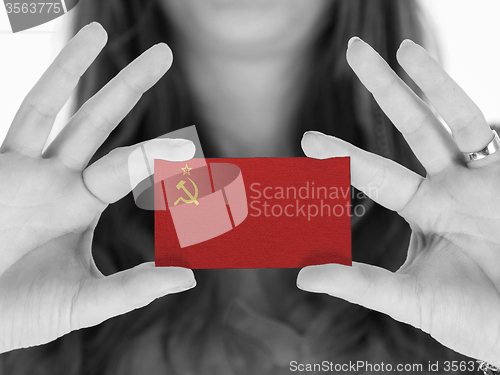 Image of Woman showing a blank business card