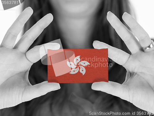 Image of Woman showing a blank business card