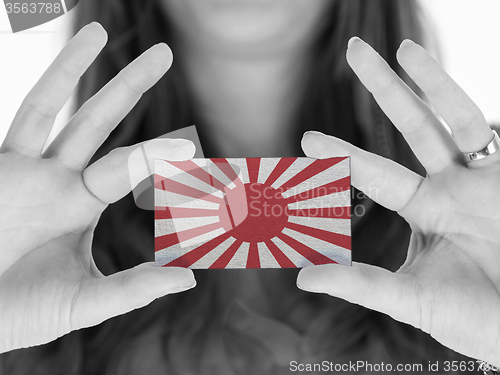 Image of Woman showing a blank business card