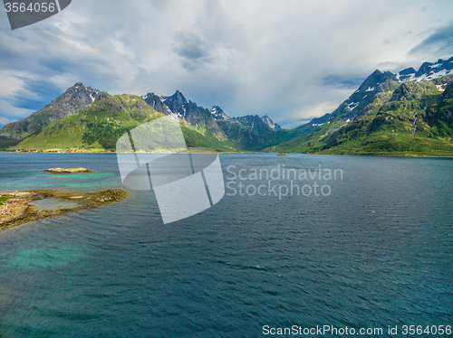 Image of Mountain peaks around fjord