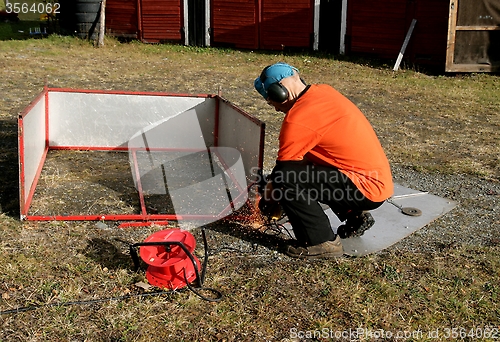 Image of Man grinding steel