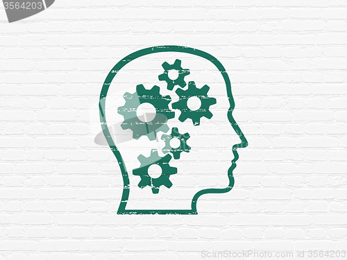 Image of Finance concept: Head With Gears on wall background