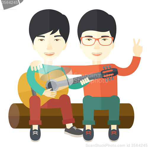 Image of Men playing guitar.