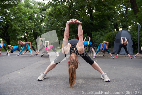 Image of jogging people group stretching