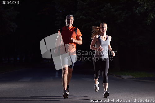 Image of couple jogging at early morning