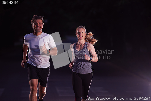 Image of couple jogging at early morning