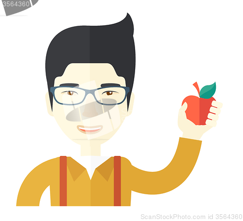 Image of Man holding apple.